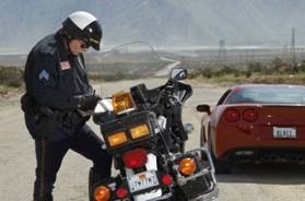 C:\Users\Michael\Desktop\3906365-traffic-cop-writing-against-motorcycle-on-country-road.jpg